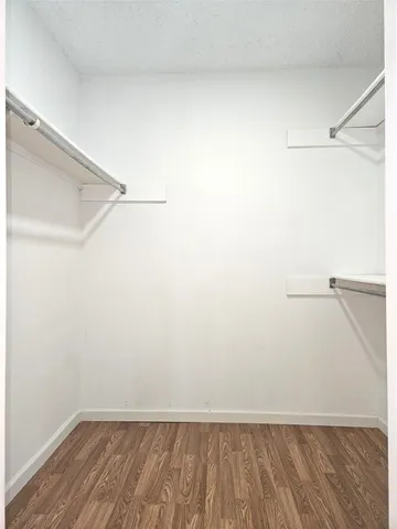 a view of an empty walk in closet