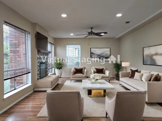 a living room with furniture and a fireplace