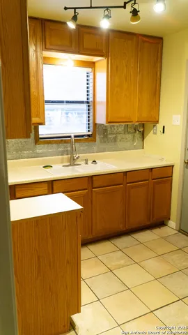 a bathroom with a sink vanity and mirror