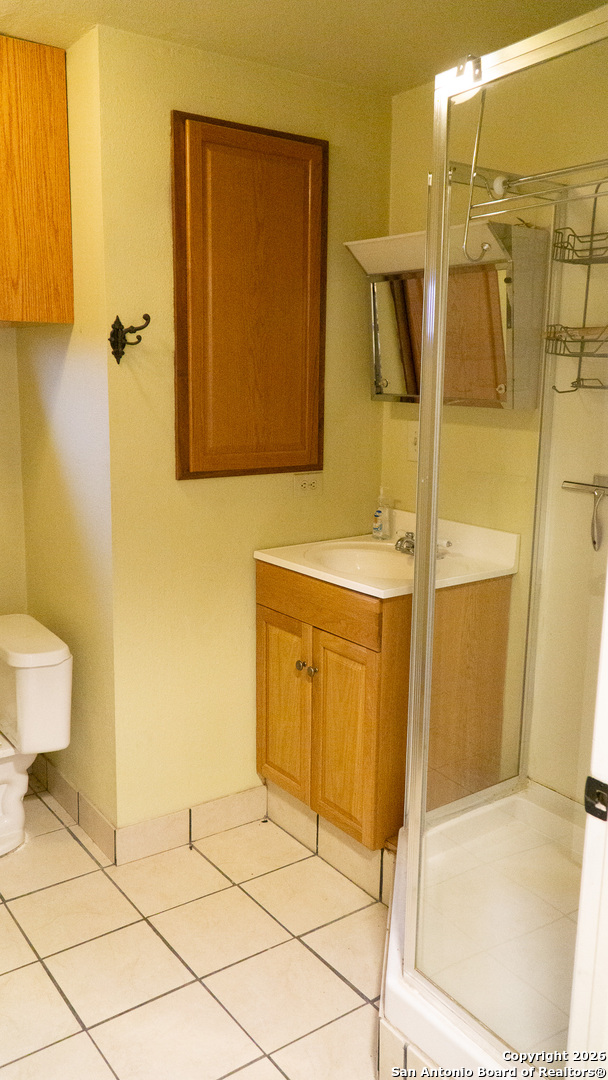 730 Main Street Utopia, TX 78884 - Photo 19 of 23 a bathroom with a sink and a mirror