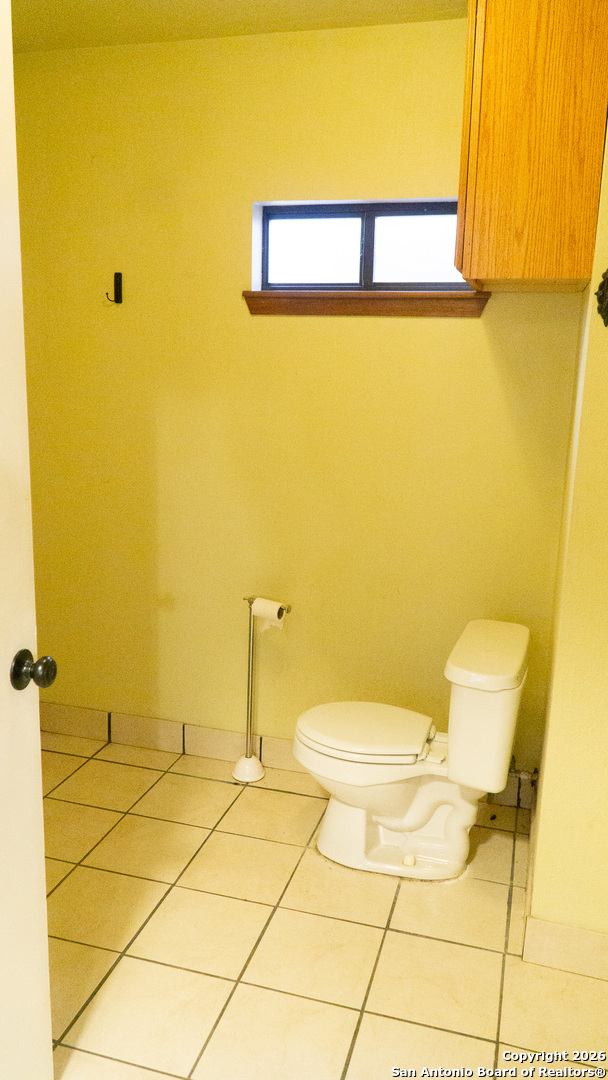 730 Main Street Utopia, TX 78884 - Photo 20 of 23 a bathroom with a sink and a toilet