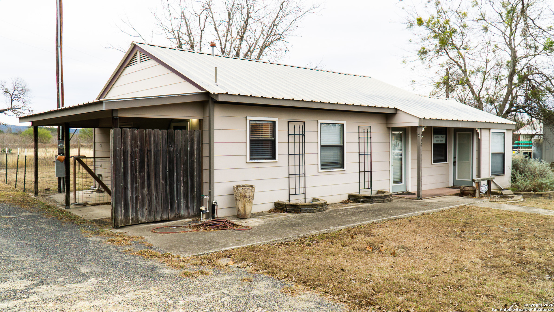730 Main Street Utopia, TX 78884 - Photo 8 of 23 a front view of a house with a yard