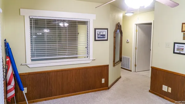 a view of a kitchen with furniture and a window