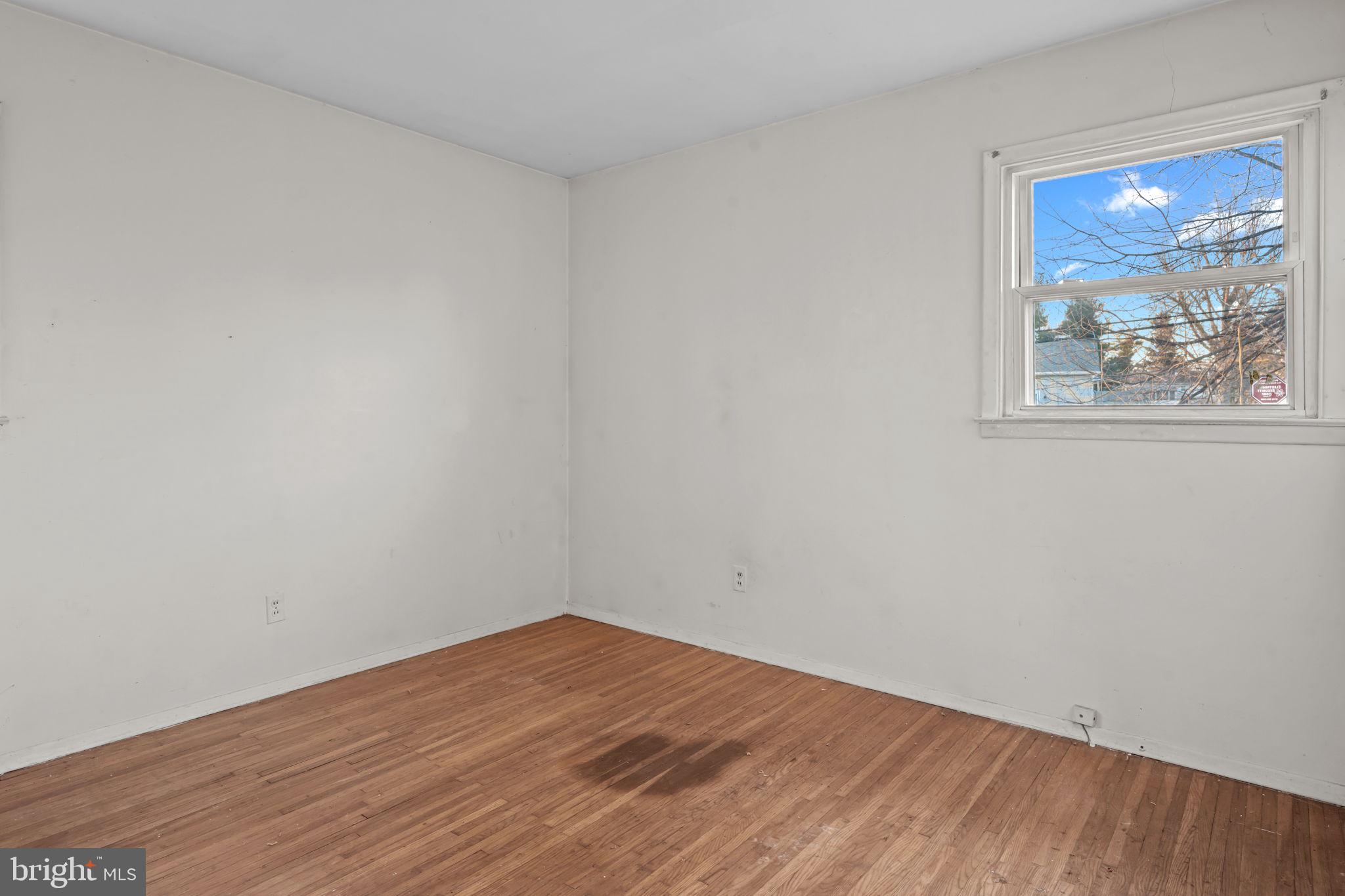 3723 Ridgewood Lane Brookhaven, PA 19015 - Photo 13 of 22 a view of empty room with wooden floor and fan