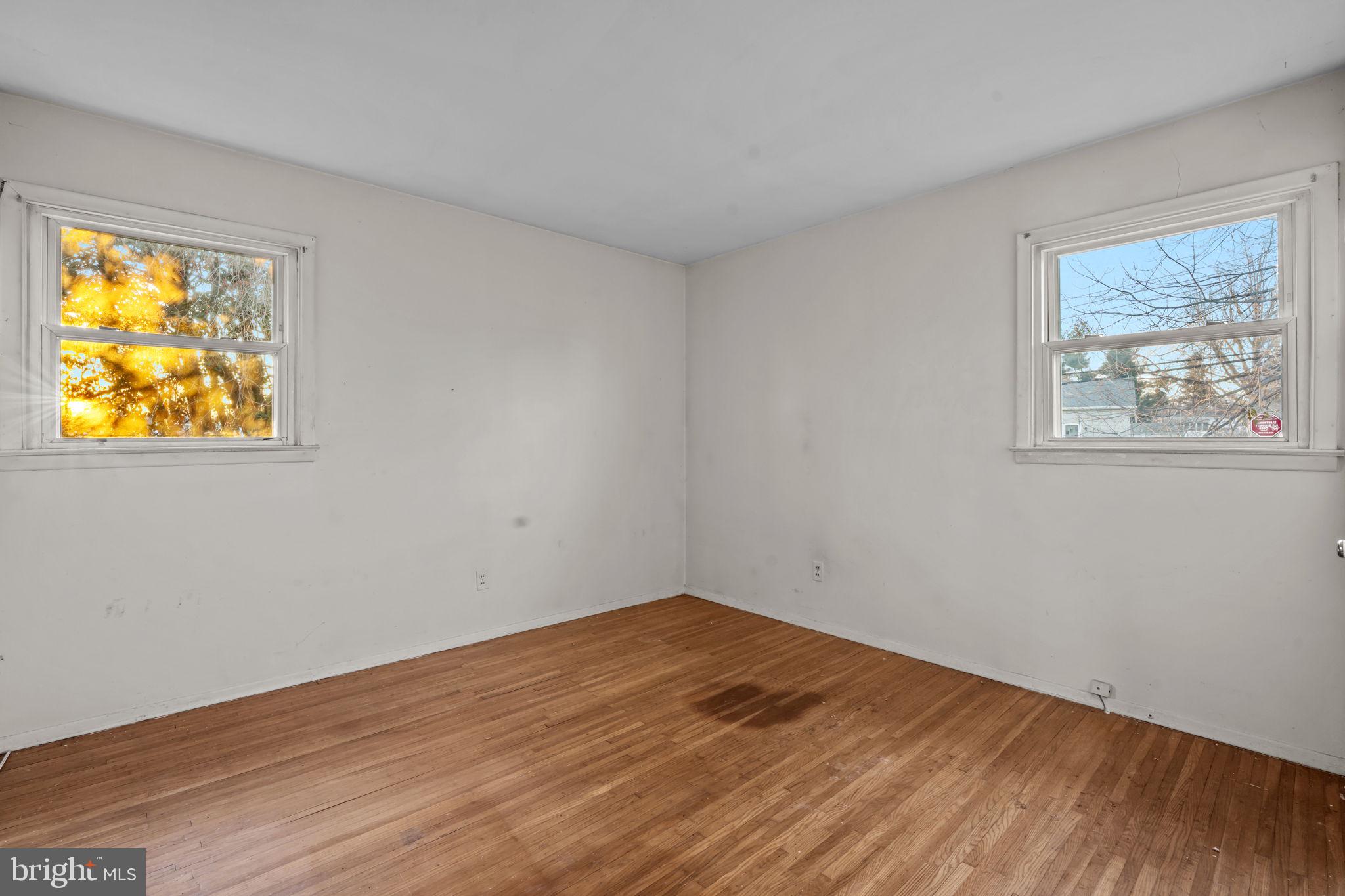 3723 Ridgewood Lane Brookhaven, PA 19015 - Photo 15 of 22 a view of an empty room with wooden floor and a window