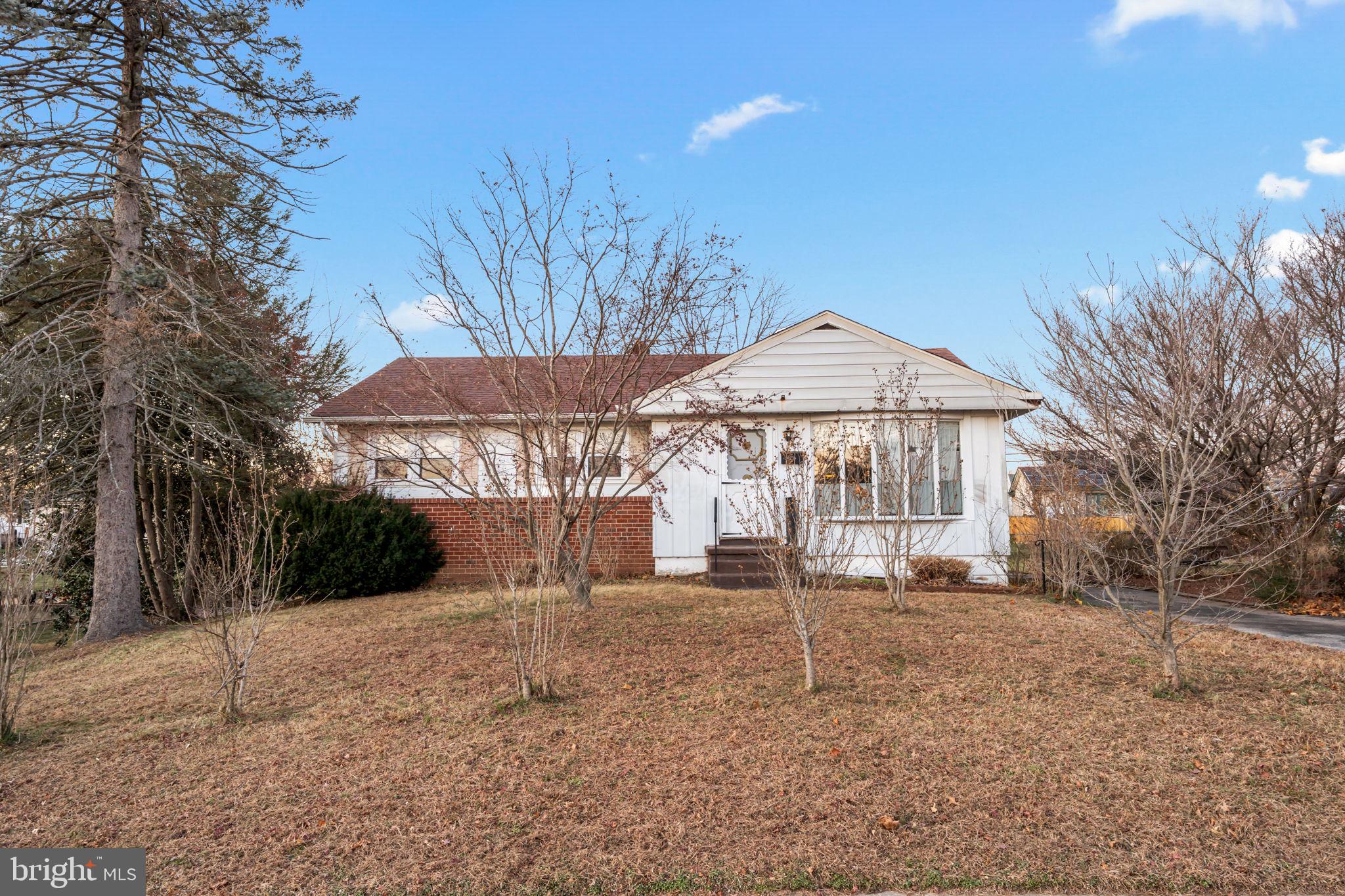 3723 Ridgewood Lane Brookhaven, PA 19015 - Photo 3 of 22 a front view of a house with a yard