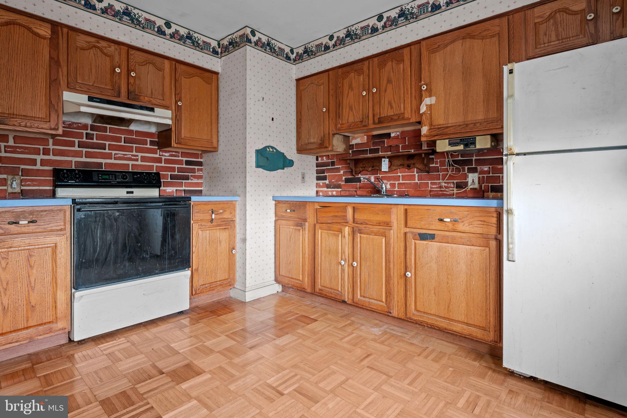 3723 Ridgewood Lane Brookhaven, PA 19015 - Photo 7 of 22 a kitchen with stainless steel appliances a stove a sink and a refrigerator