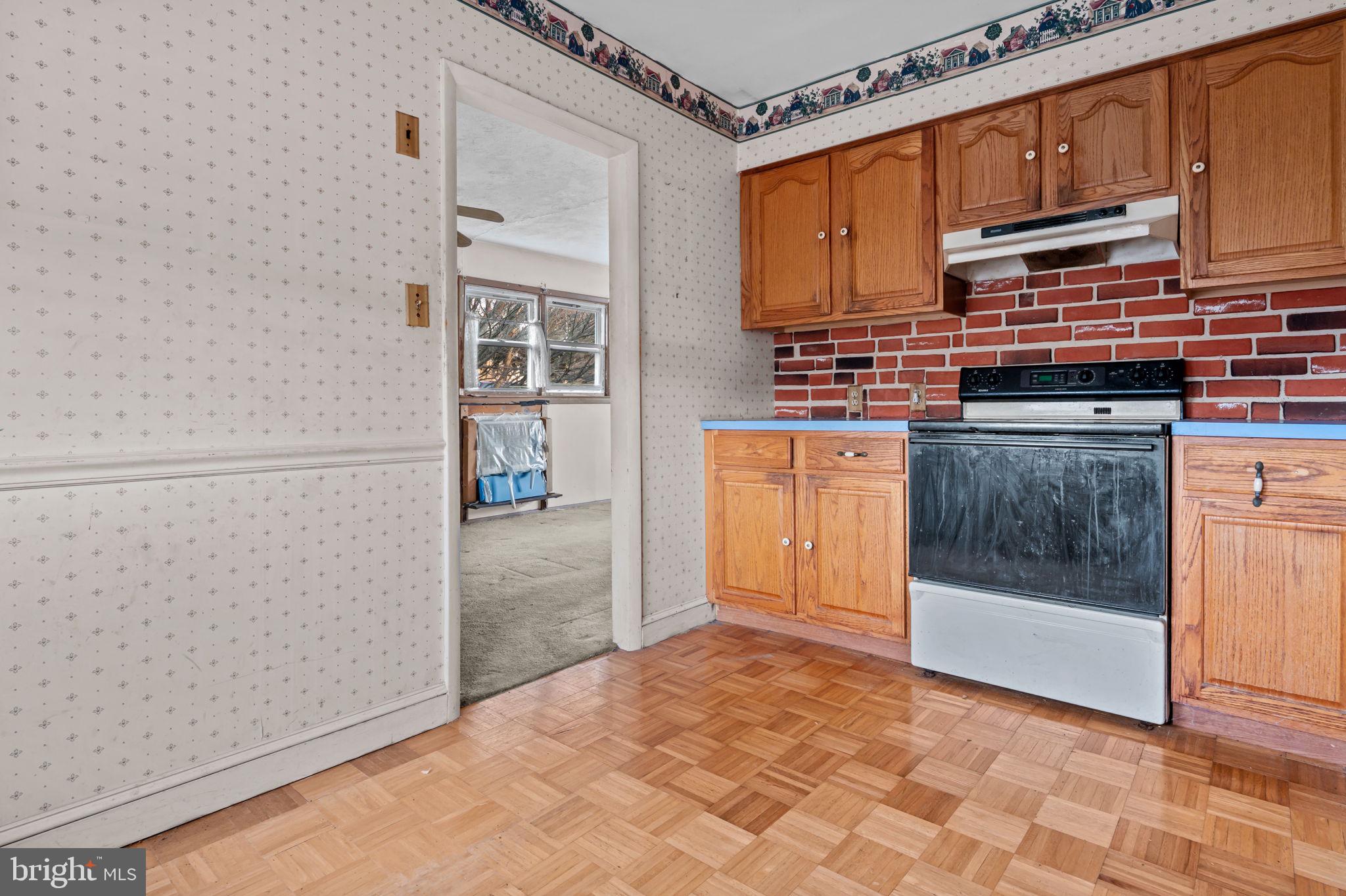 3723 Ridgewood Lane Brookhaven, PA 19015 - Photo 8 of 22 a kitchen with stainless steel appliances granite countertop a refrigerator and a stove top oven