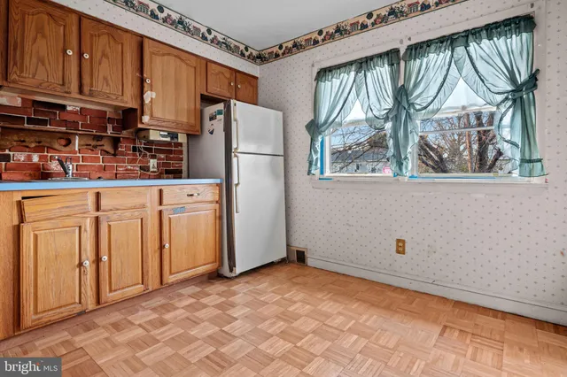 a view of a kitchen with furniture and window