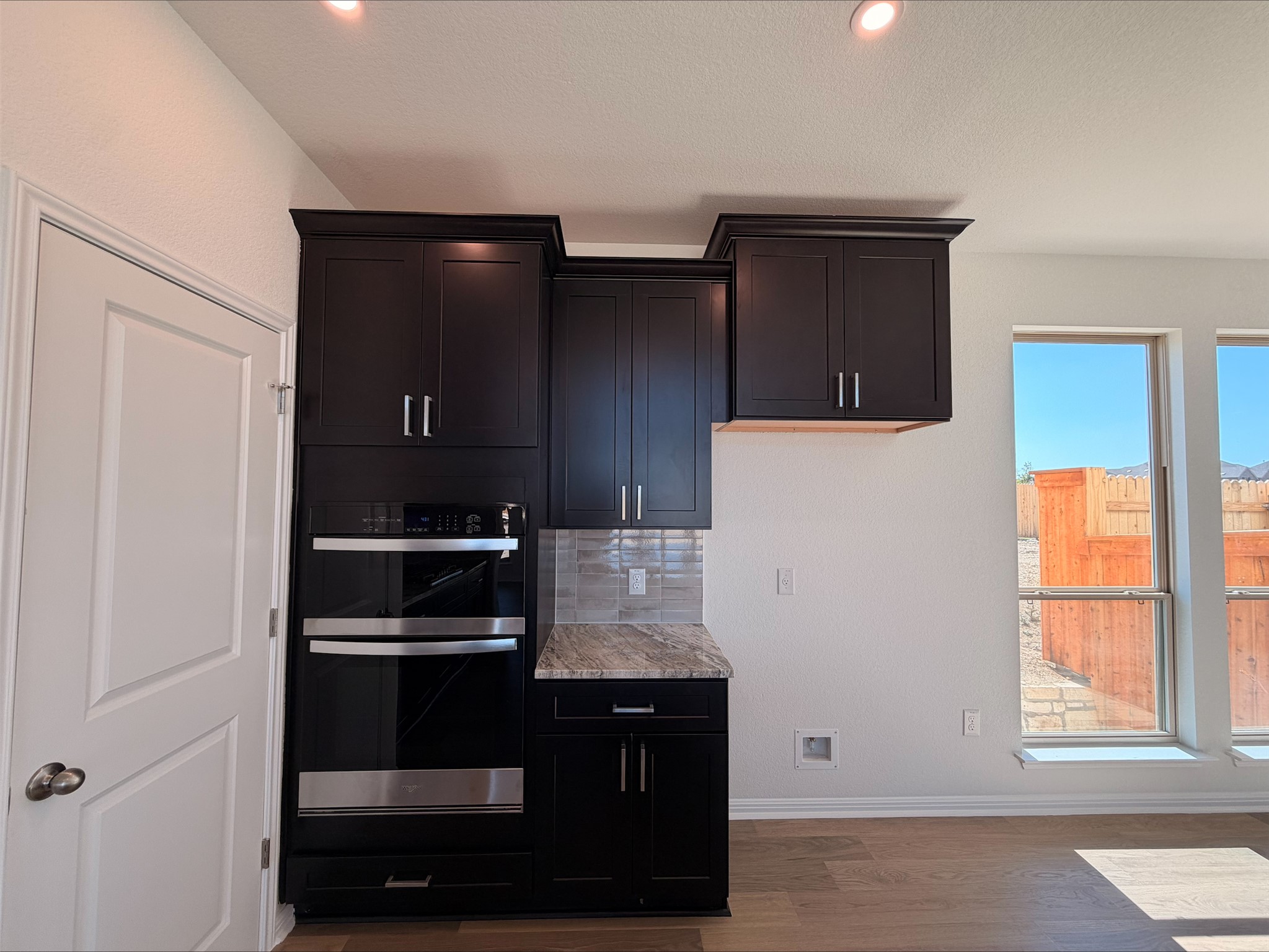 323 Elephant Island Loop Kyle, TX 78640 - Photo 6 of 15 a kitchen with a refrigerator and window