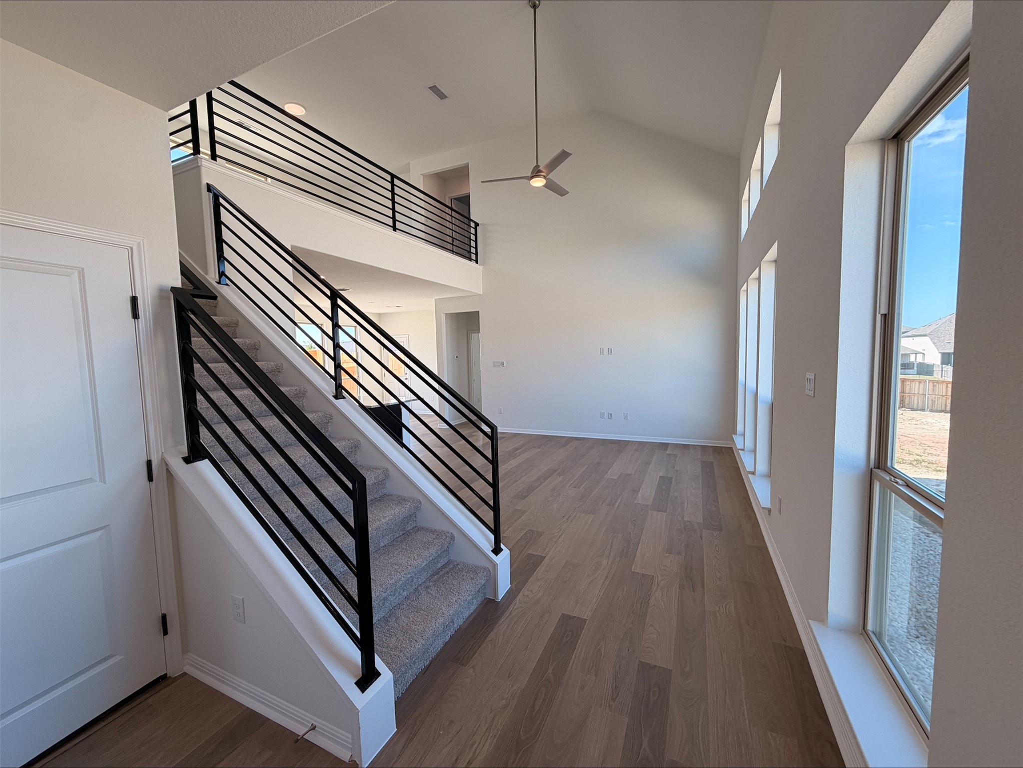323 Elephant Island Loop Kyle, TX 78640 - Photo 7 of 15 a view of entryway and hall with wooden floor