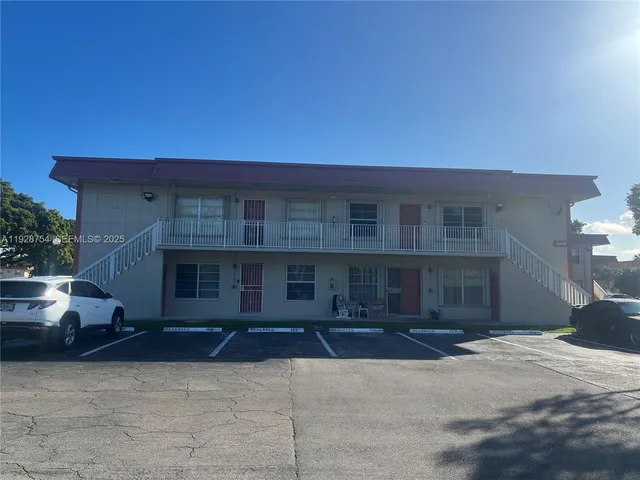 a backyard of a house with yard and outdoor seating