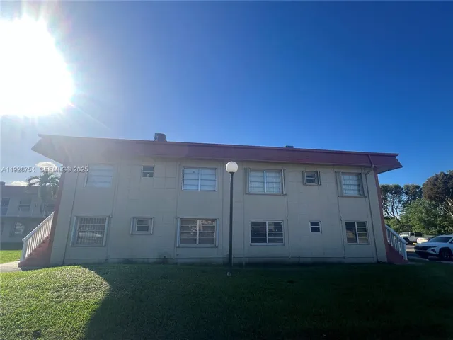 a house view with a garden space