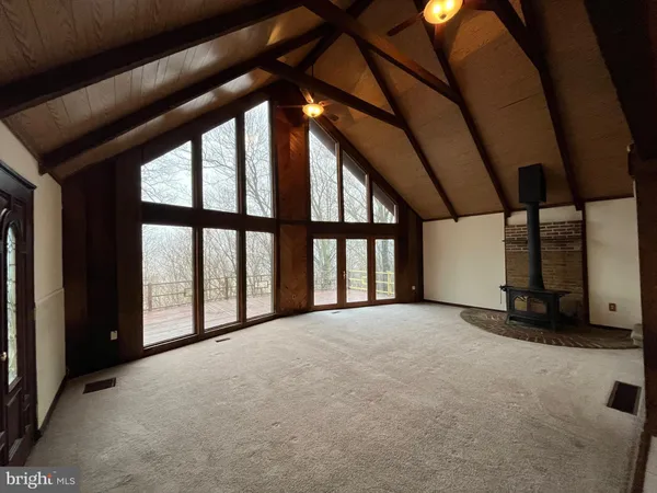 a view of an empty room with a large window