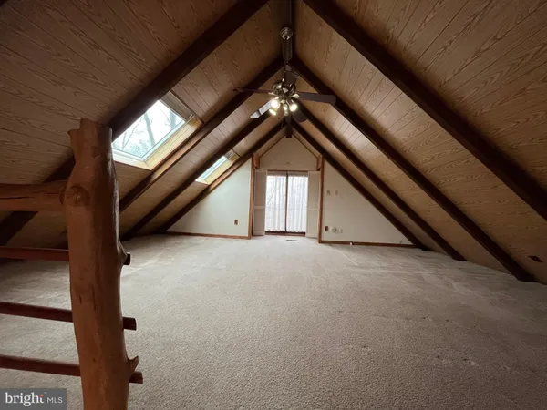 a view of empty room with windows
