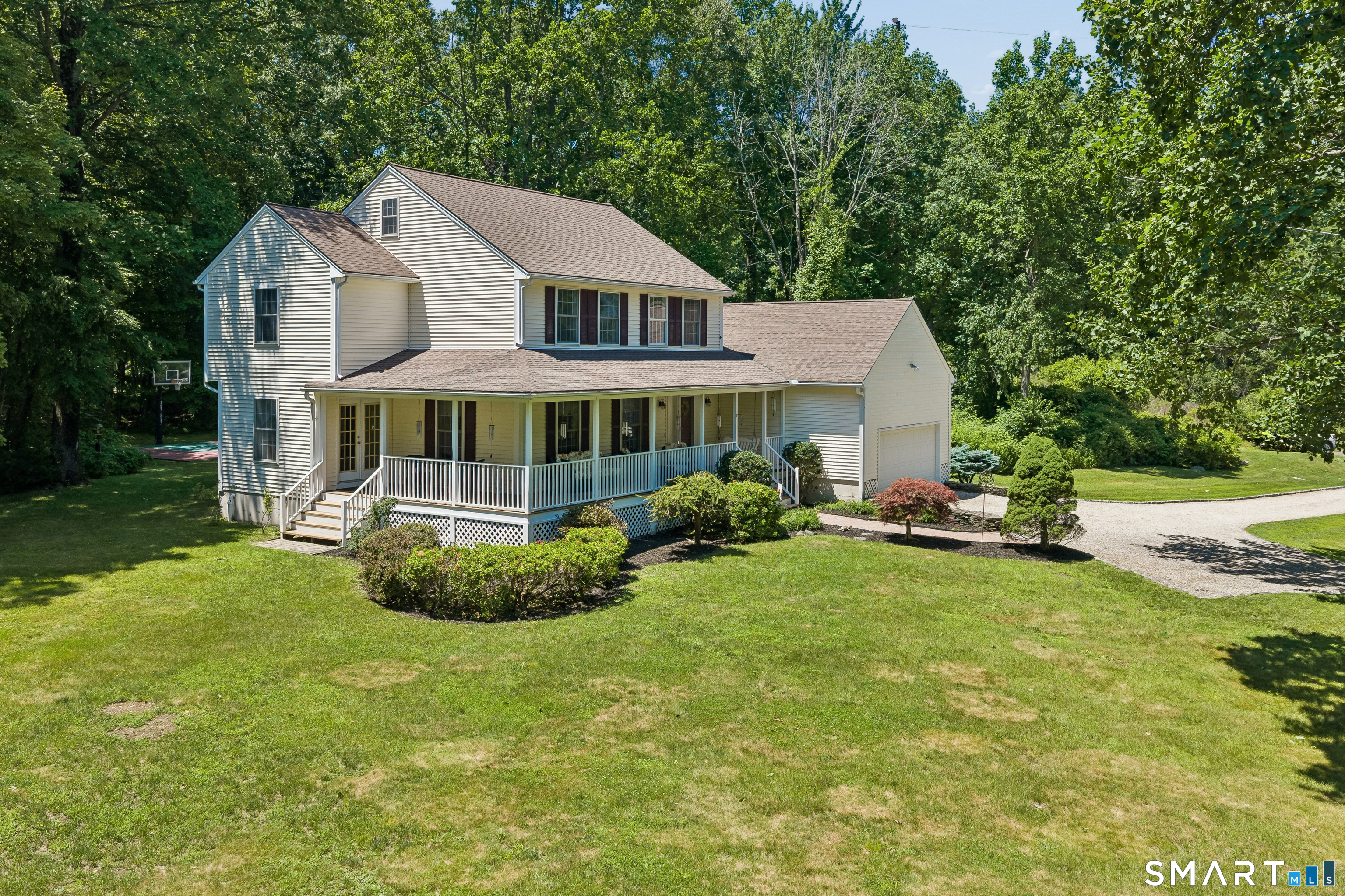 10 Ferris Road Newtown, CT 06470 - Photo 3 of 40 a aerial view of a house with swimming pool and porch
