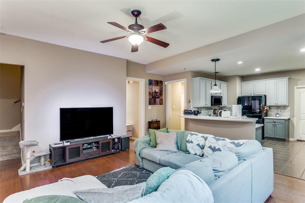 9117 Ripley Street Fort Worth, TX 76244 - Photo 7 of 35 Open-concept living space featuring wood-finish flooring, a ceiling fan with integrated lighting, and recessed lighting