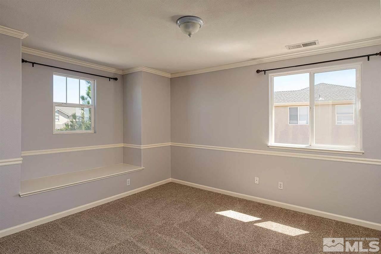 3443 Weaver Place Reno, NV 89512 - Photo 13 of 23 a view of a livingroom with an empty space and a window