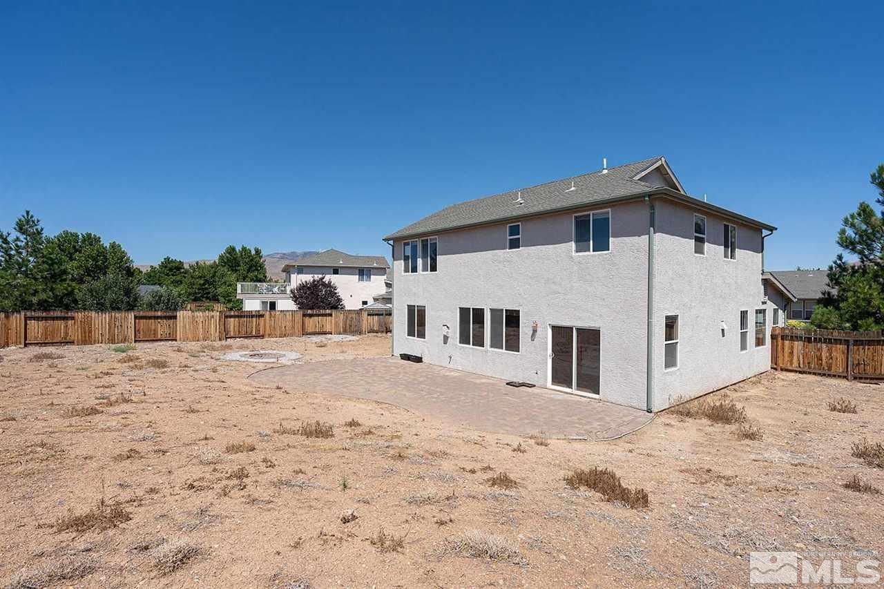 3443 Weaver Place Reno, NV 89512 - Photo 21 of 23 a view of a house with a yard