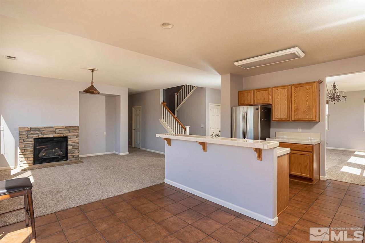 3443 Weaver Place Reno, NV 89512 - Photo 5 of 23 a view of kitchen with sink microwave and refrigerator