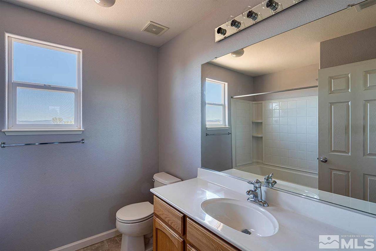 3443 Weaver Place Reno, NV 89512 - Photo 10 of 23 a bathroom with a sink toilet and shower