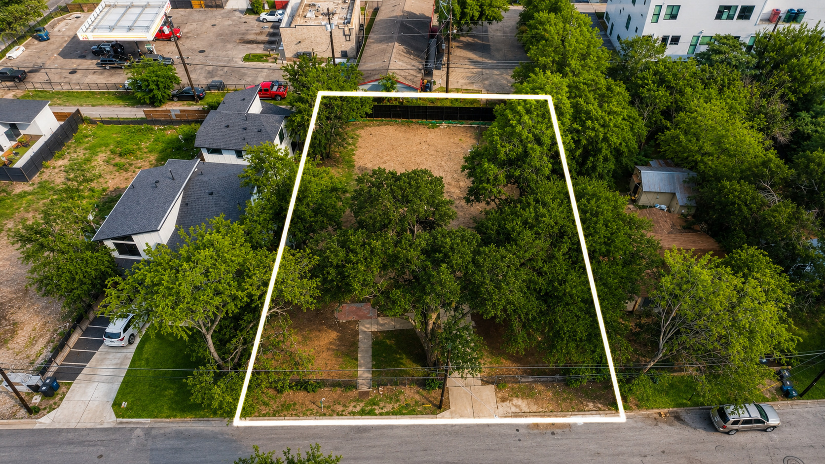 2017 East 8th Street Austin, TX 78702 - Photo 2 of 7 A verdant, tree-filled lot provides a tranquil setting for a future dream home.