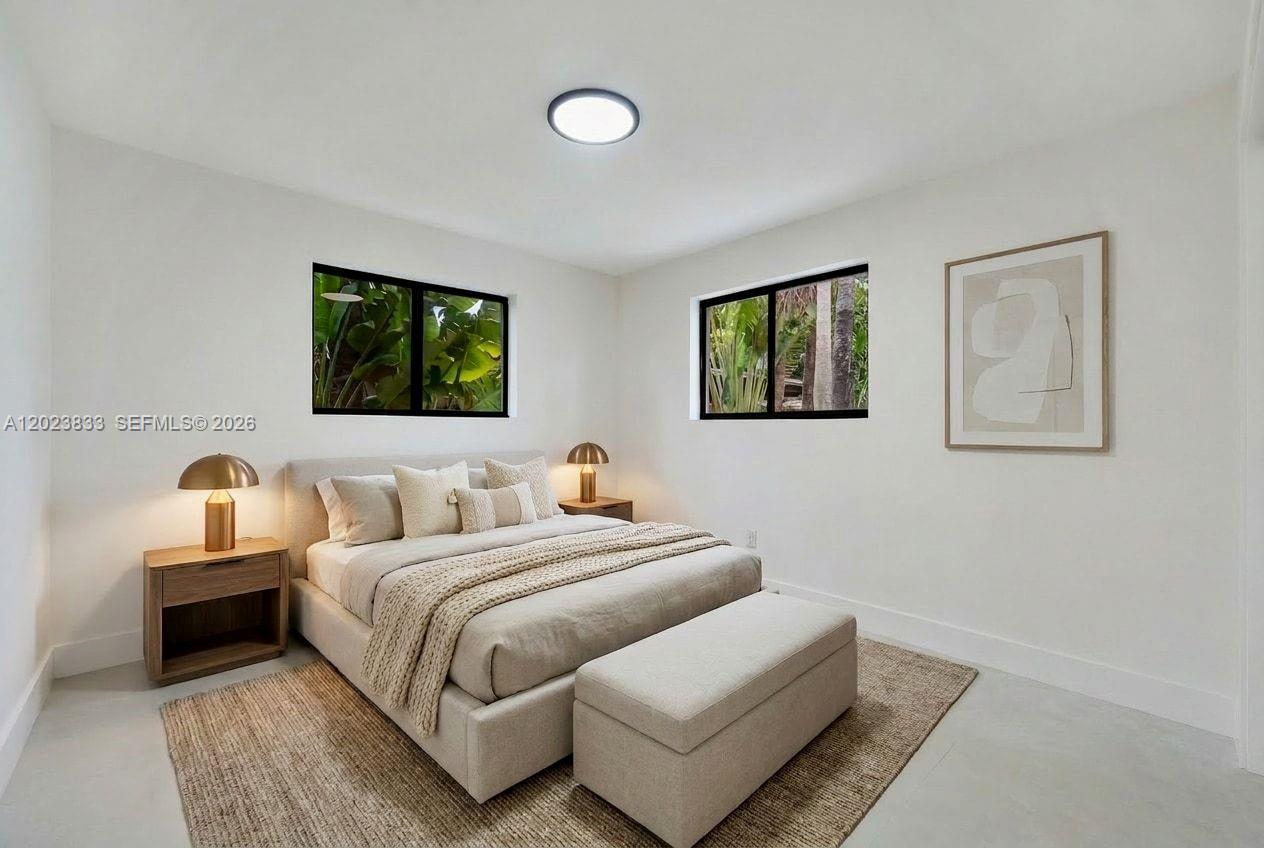 6566 Southwest 35th Street Miami, FL 33155 - Photo 21 of 36 a bedroom with bed and wall painting