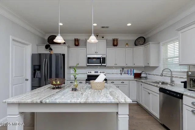a bedroom with a bed and a ceiling fan