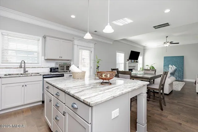 a view of a house with a yard and sitting area