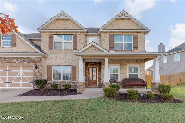 a view of entryway with wooden floor and stairs