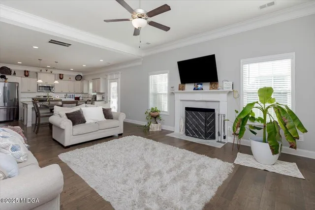 a kitchen with cabinets stainless steel appliances a sink and a window