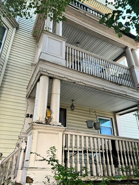 38 Chestnut Street Lynn, MA 01902 - Photo 2 of 9 front view of a house with a balcony