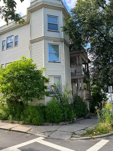 38 Chestnut Street Lynn, MA 01902 - Photo 3 of 9 a view of a house with a yard