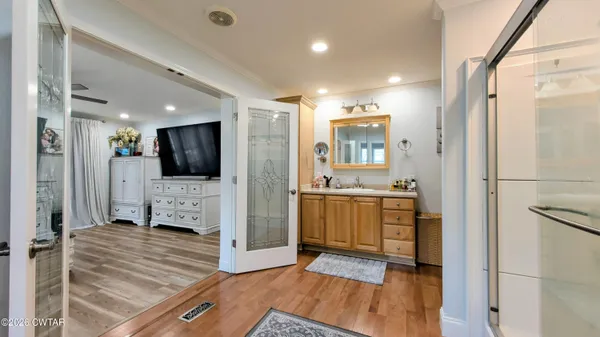 a living room with furniture window and wooden floor