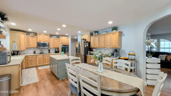 a view of a kitchen and dining room