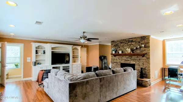 a living room with furniture and stairs