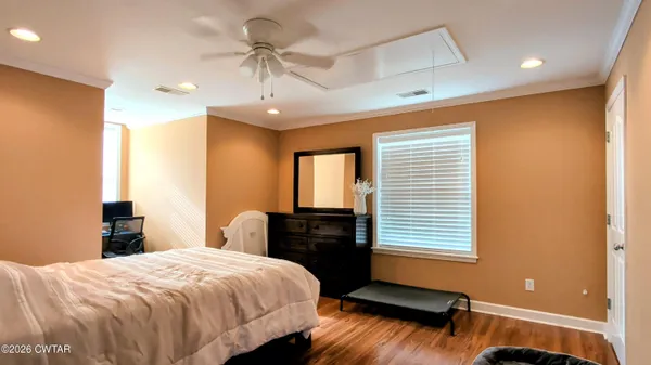 a bedroom with a bed and a desk