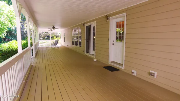 a dining room with furniture and chandelier