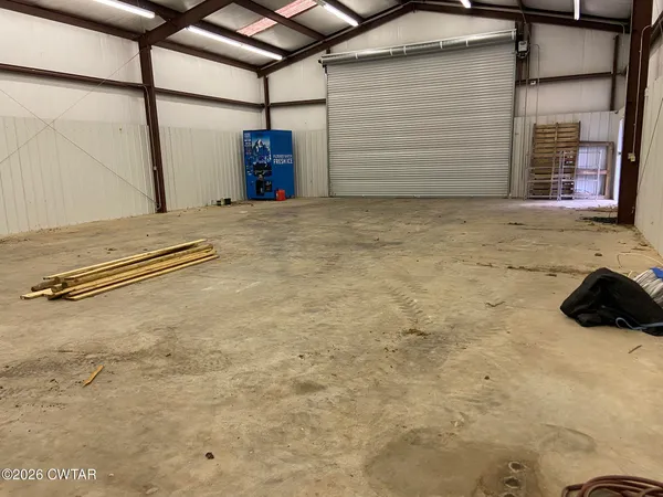 a view of a swimming pool with a yard