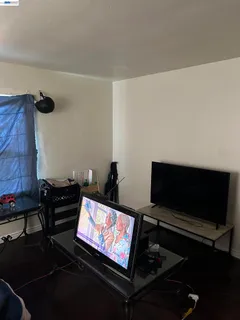 a bedroom with bed and window