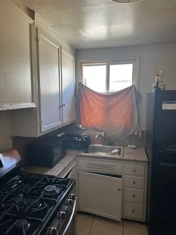 a sitting area with furniture and rug