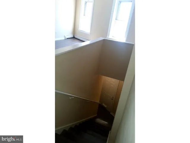 a open living room with a wooden floor