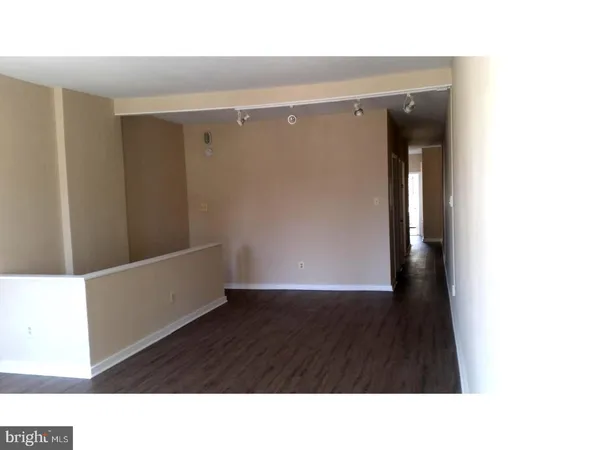 a kitchen with a refrigerator and a microwave