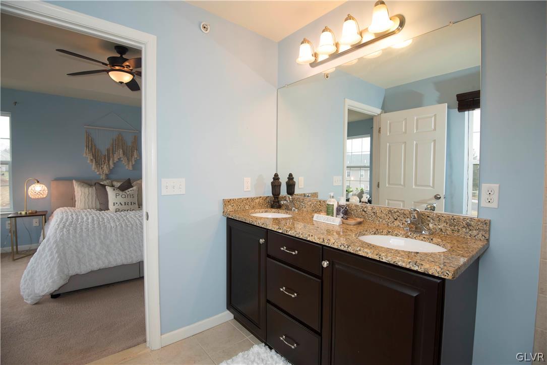 2406 Gentle Hollow Road Whitehall, PA 18052 - Photo 25 of 37 a en suite bathroom with a sink double vanity and a mirror