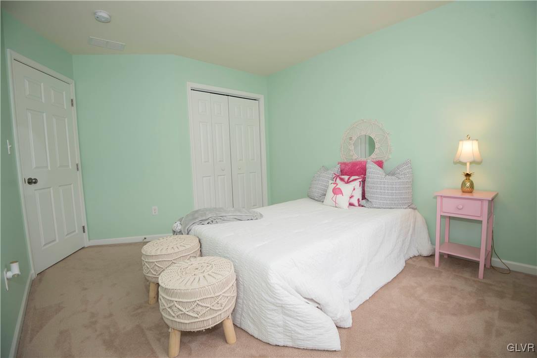 2406 Gentle Hollow Road Whitehall, PA 18052 - Photo 27 of 37 a spacious bedroom with a bed and a table