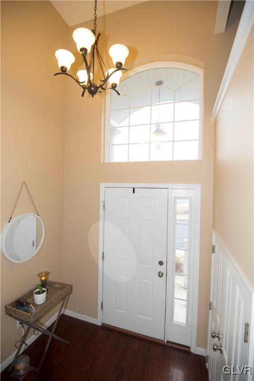 2406 Gentle Hollow Road Whitehall, PA 18052 - Photo 4 of 37 a view of a room with a chandelier fan and wooden floor