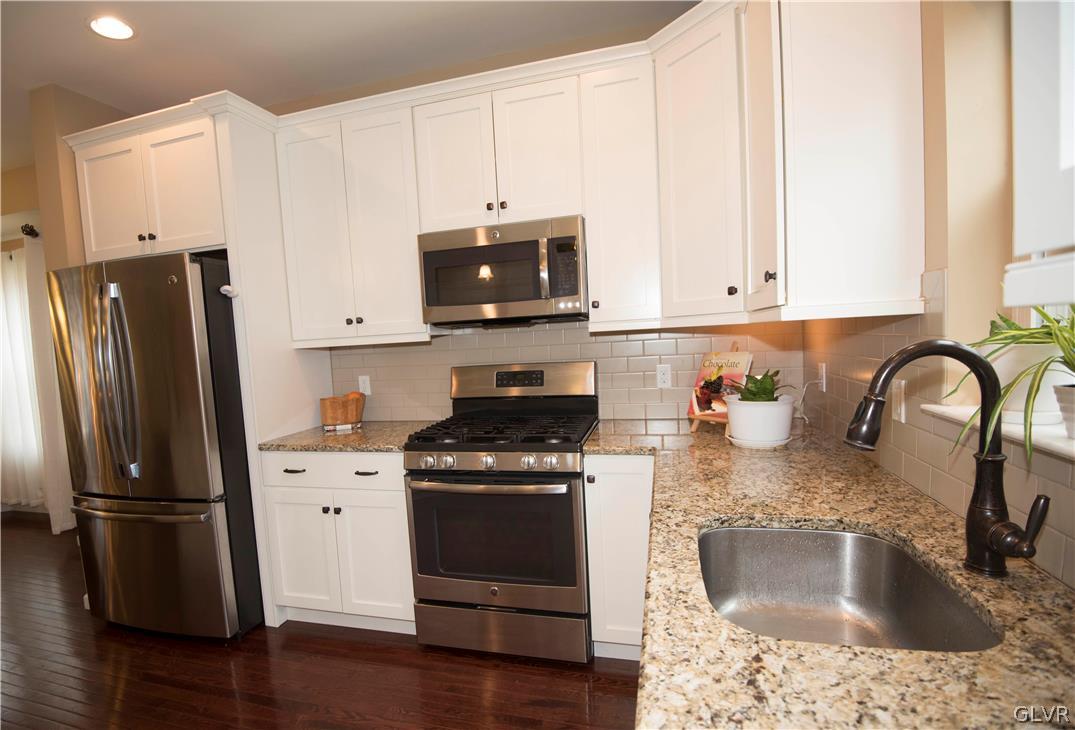 2406 Gentle Hollow Road Whitehall, PA 18052 - Photo 10 of 37 a kitchen with granite countertop a refrigerator stove and sink