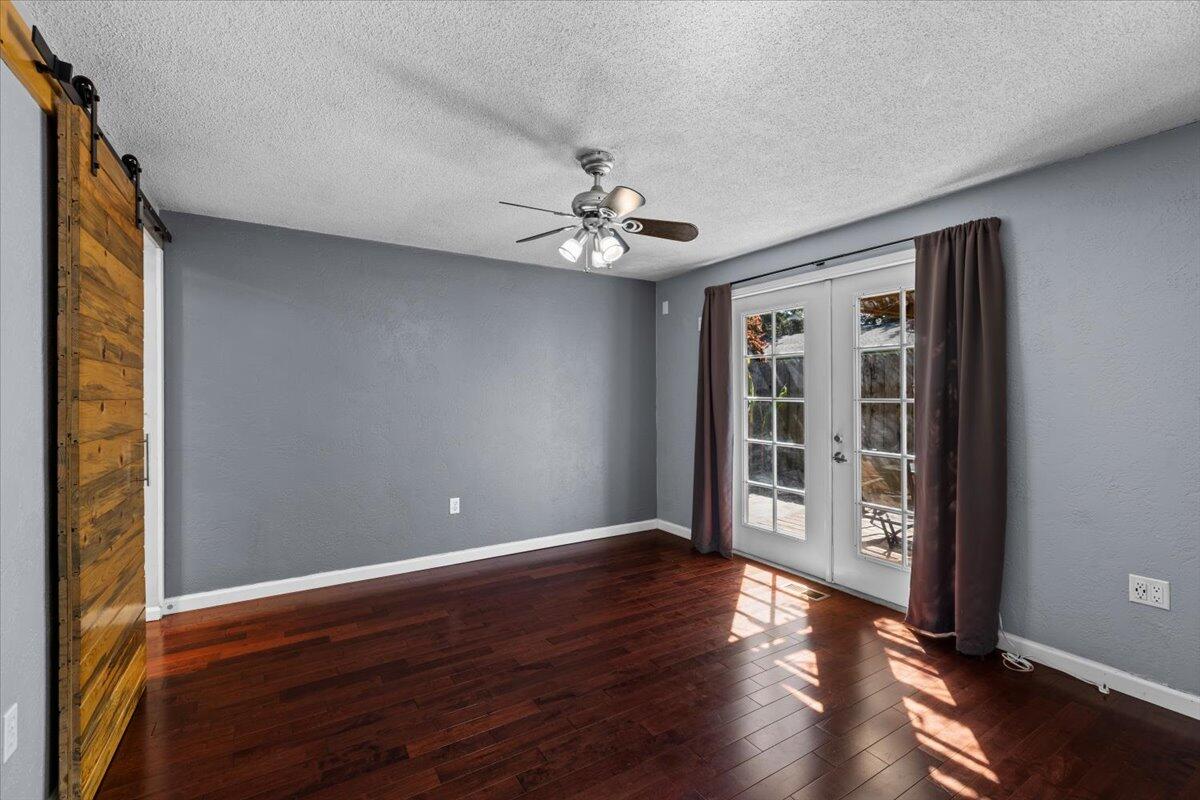 113 Houston Road Phoenix, OR 97535 - Photo 16 of 29 a view of an empty room with window and wooden floor