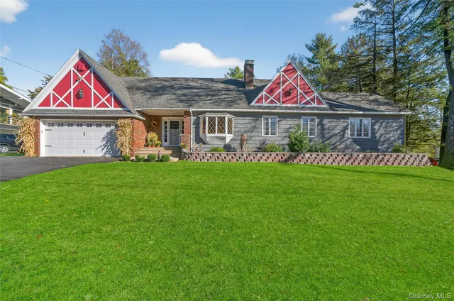 a front view of house with yard and green space