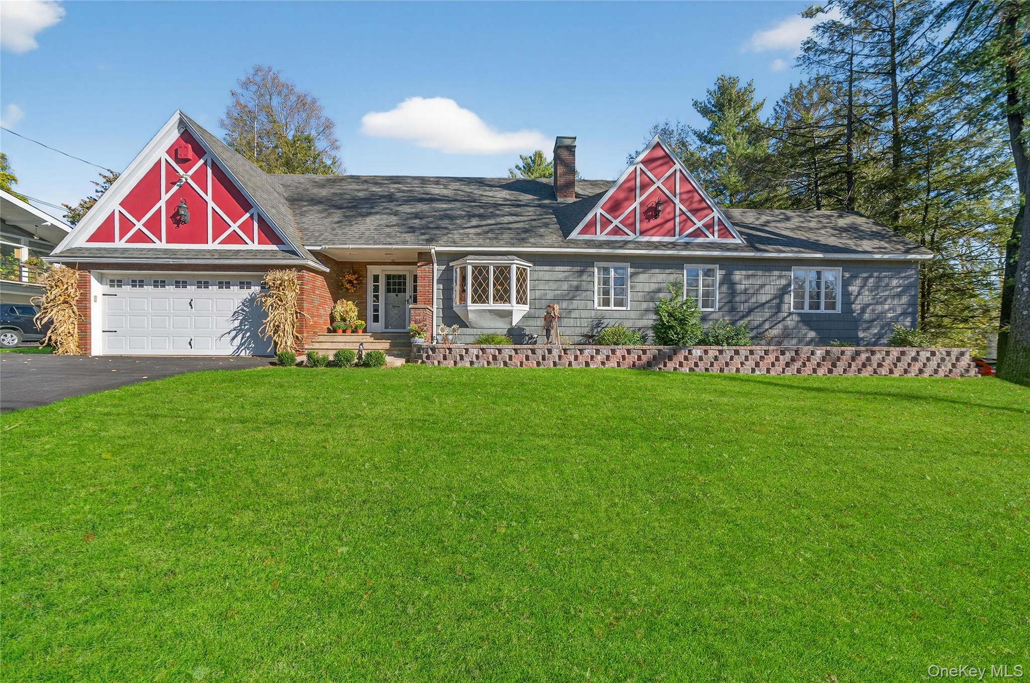 a front view of house with yard and green space